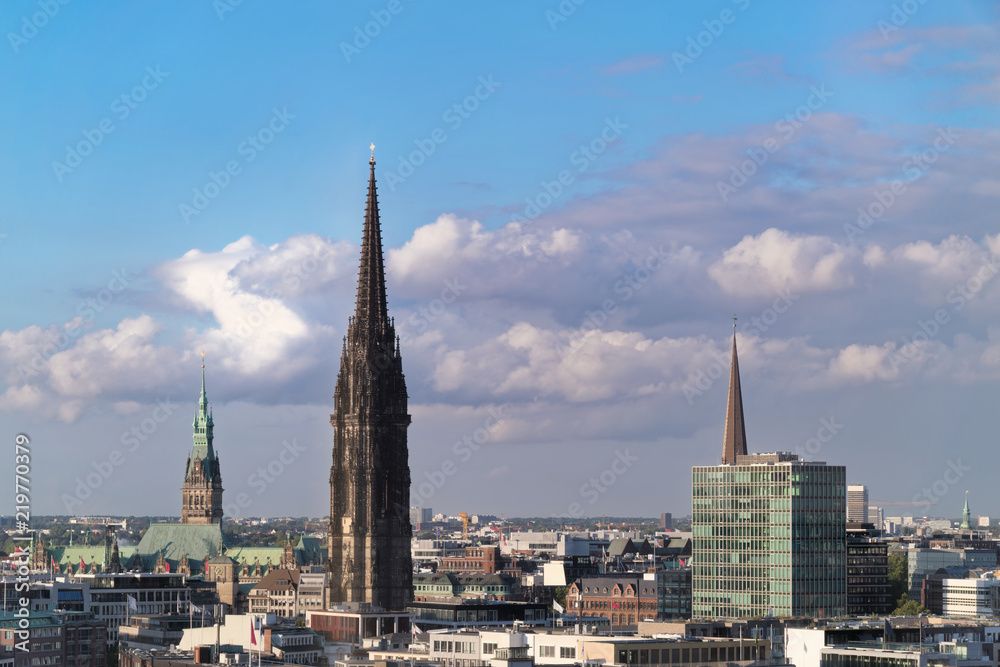 The Church of St. Nicholas in Hamburg, Germany against amazing cloudy sky