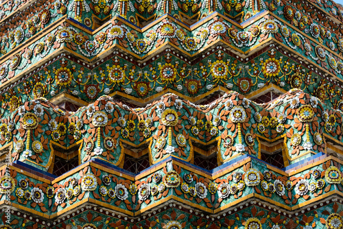 Close up beauitful mosaic tiles of large stupas in Wat Pho or Wat Phra Chetuphon Vimolmangklararm Rajwaramahaviharn is one of Bangkok's oldest temples photo