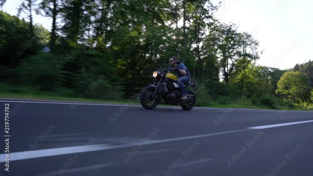 motorbike on the road riding. having fun riding the empty road on a motorcycle tour / journey motorbike on the road riding. having fun riding the empty road on a motorcycle tour / journey