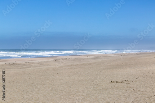 An empty stretch of sandy beach on the Californian Coast