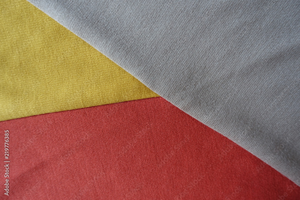 Fototapeta premium Pieces of yellow, orange and beige fabrics sewn together