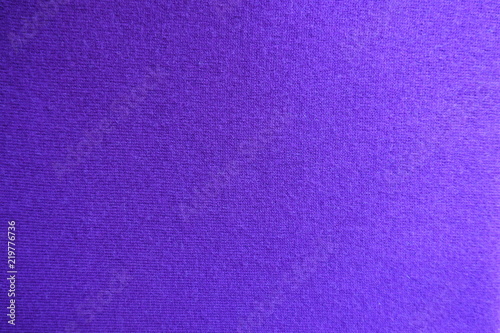 Texture of violet knitted fabric from above
