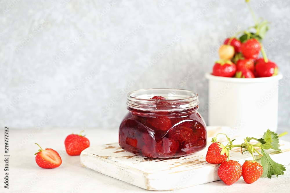 Strawberry marmalade. Homemade strawberry jam in glass jar overhead rustic wooden table. Copy space Strawberry marmalade. Homemade strawberry jam in glass jar overhead rustic wooden table. Copy space