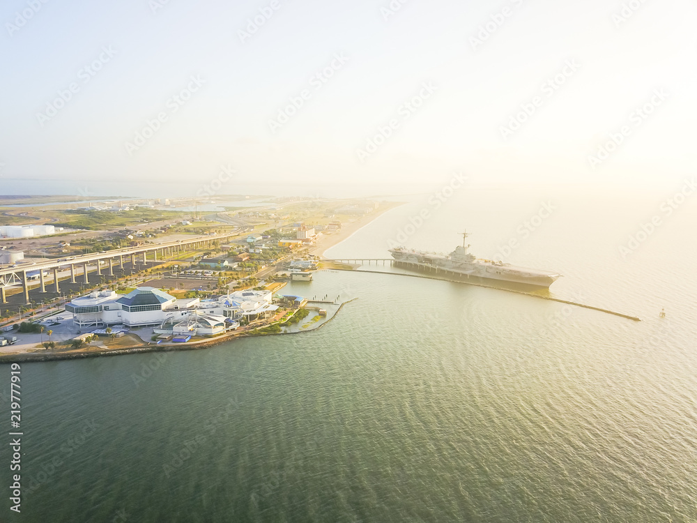 Obraz premium Aerial view North Beach in Corpus Christi, Texas, USA with aircraft carrier ship