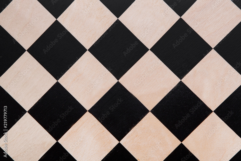 Fototapeta premium Top view on the black and white checkered texture, chessboard