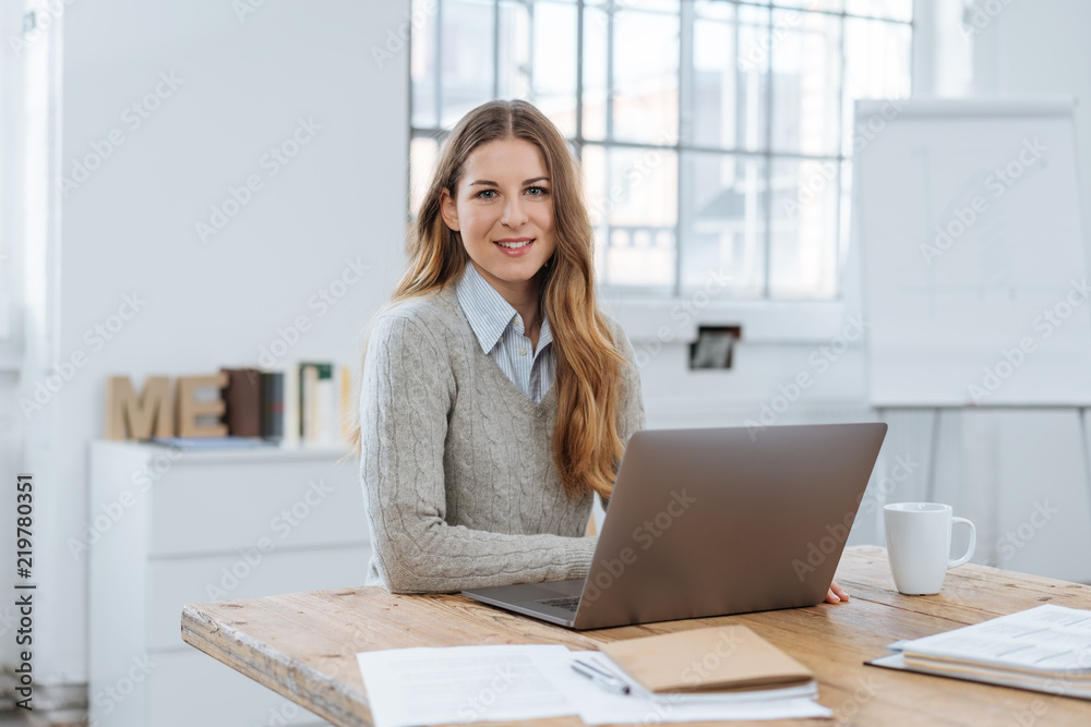 Friendly young businesswoman with a quiet smile Friendly young businesswoman with a quiet smile