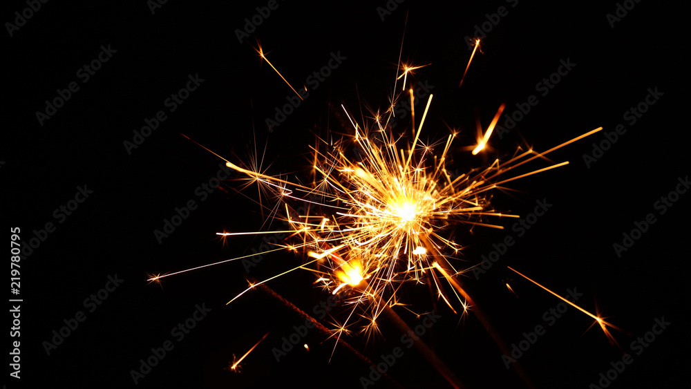Close up several firework sparklers over black Close up several firework sparklers over black