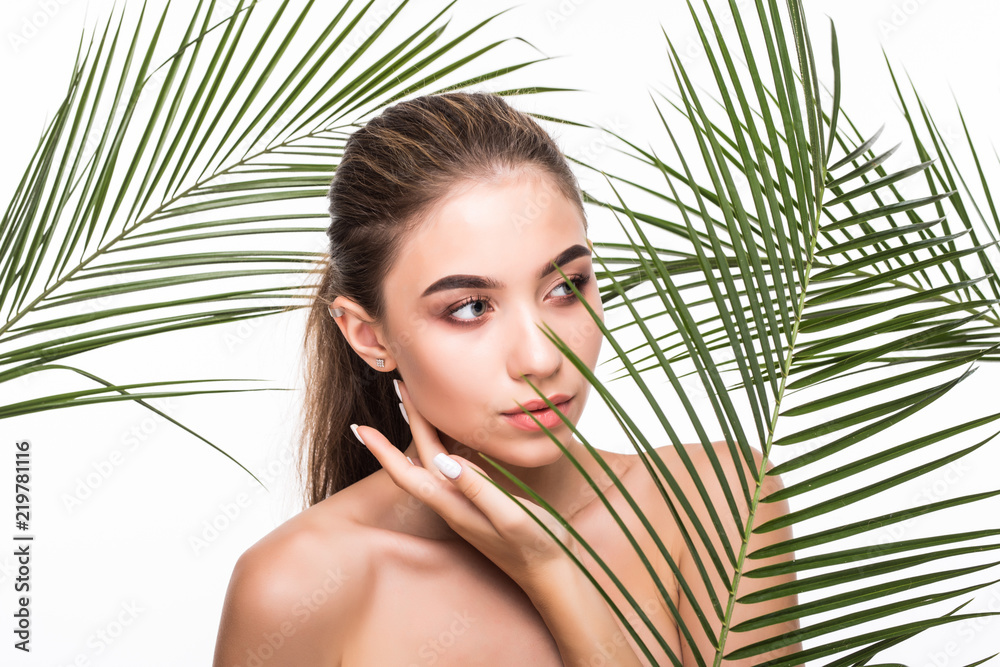 Young beauty smiling woman with natural make up and green leaves. Youth, teens and skin care concept. Spa and wellness. Make up, long hair and lashes. Young beauty smiling woman with natural make up and green leaves. Youth, teens and skin care concept. Spa and wellness. Make up, long hair and lashes.