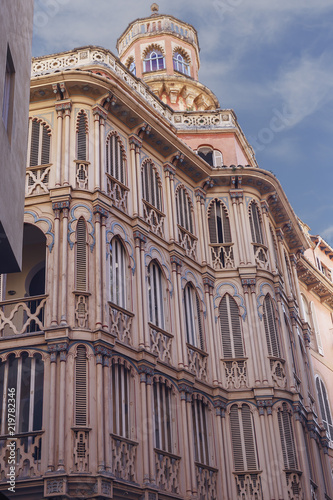 side view on the facade of a beautiful building of the eighteenth sky against the blue sky