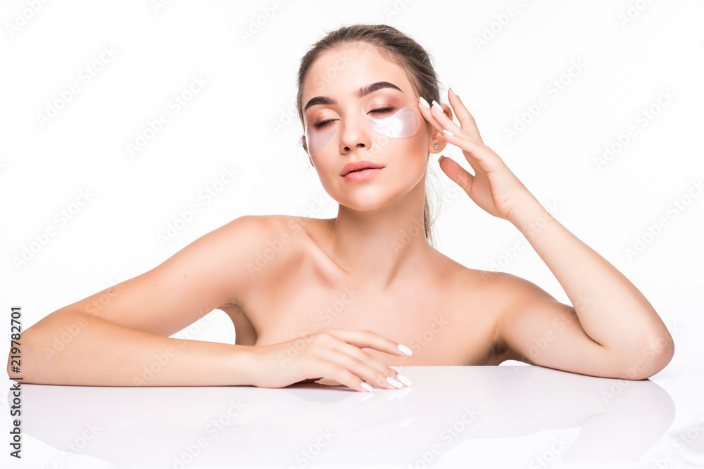 Portrait of beauty woman with natural make-up and hyaluronic acid hydrogel patches on fresh skin. Female face with mask under eyes. Cosmetology and skin care. Portrait of beauty woman with natural make-up and hyaluronic acid hydrogel patches on fresh skin. Female face with mask under eyes. Cosmetology and skin care.