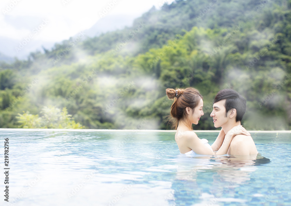 Young asian couple relaxing in hot springs Young asian couple relaxing in hot springs