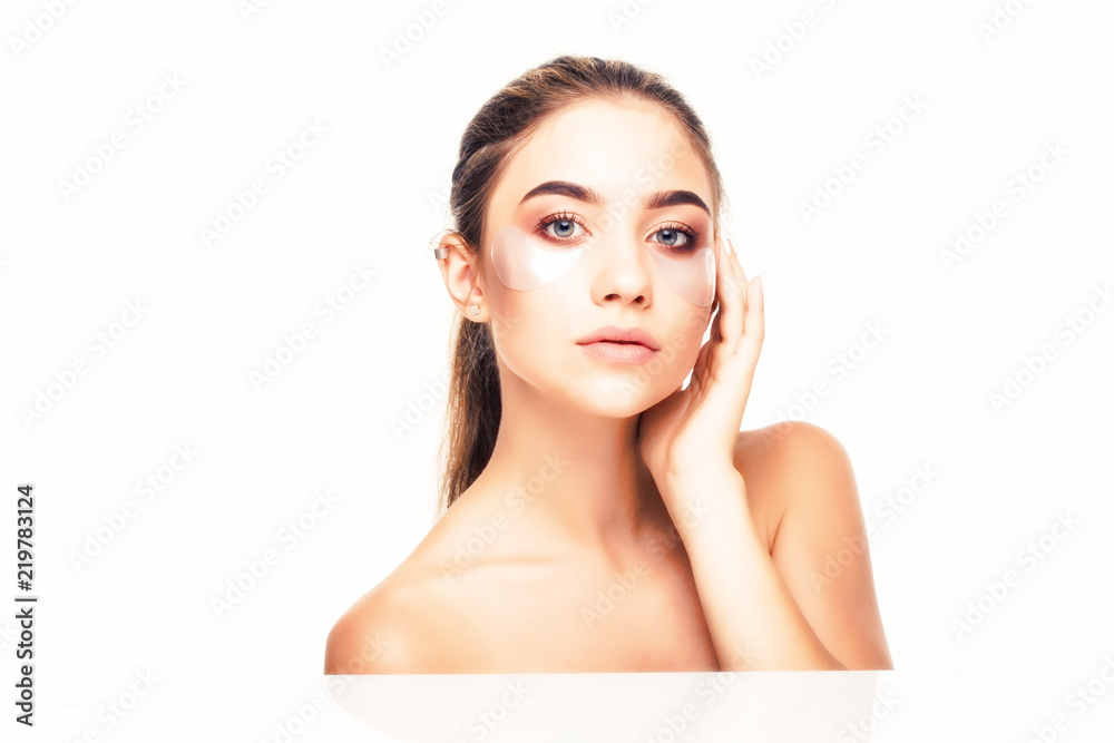 Young beauty Woman with collagen pads under her eyes on white background. Skin care concept. Young beauty Woman with collagen pads under her eyes on white background. Skin care concept.