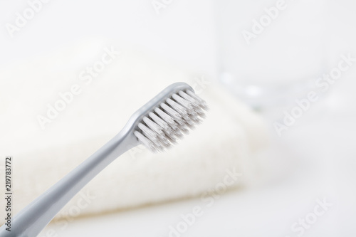 Clean toothbrush and a glass of water.