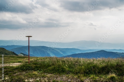 A pillar on the tourist trail in the mountains. Carpathians. Ukraine.