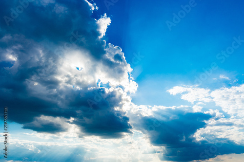 Deep blue sky and clouds, may be used as background.