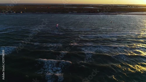 Slow shooting, bright training kites in the sea photo