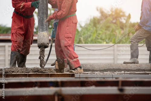 Construction men worker boom concrete on floor