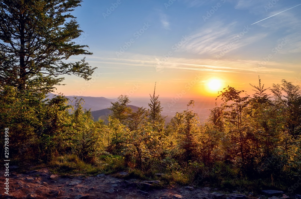 Beautiful mountain landscape. Sunset over the hills and cities. Beautiful mountain landscape. Sunset over the hills and cities.