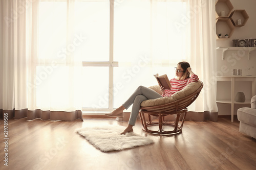Young woman reading interes...