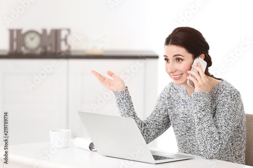 Young female freelancer tal...