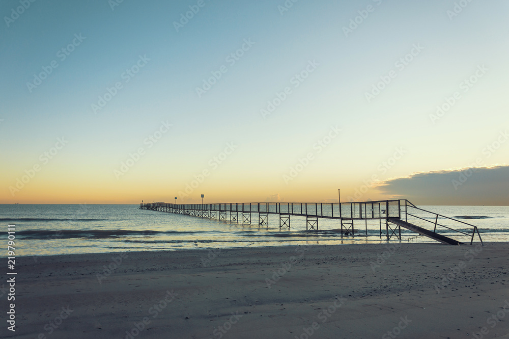 Sandy beaches of Rimini shortly after dawn in winter Sandy beaches of Rimini shortly after dawn in winter