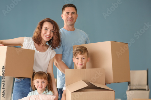 Happy family with cardboard...