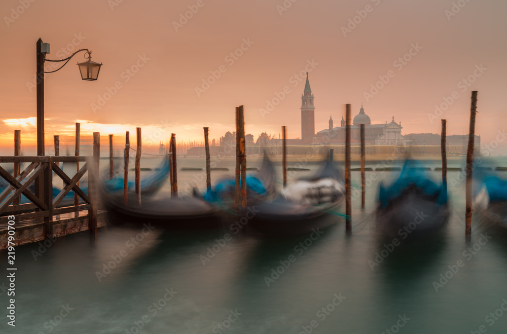 Morning in Venice. Gondolas at the pier. Italy.