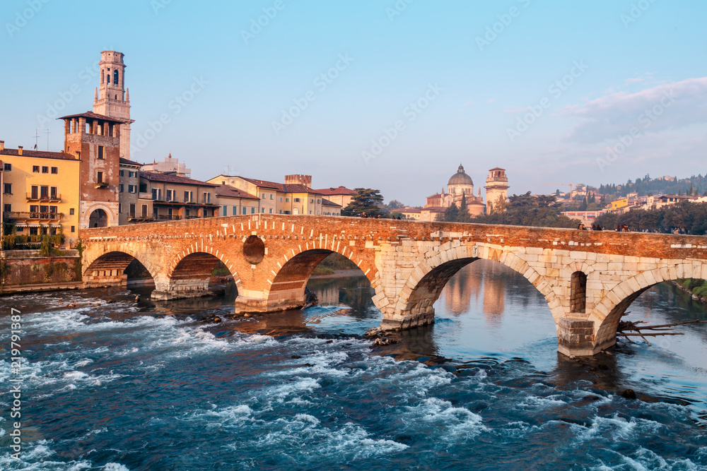 City view of Verona with the Dom Santa Maria Matricolare and Roman bridge Ponte Pietra on the River Adige in Verona. Italy. Europe.