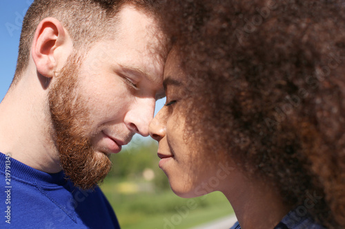 Young loving interracial co...
