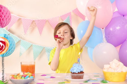 Cute little boy with party ...