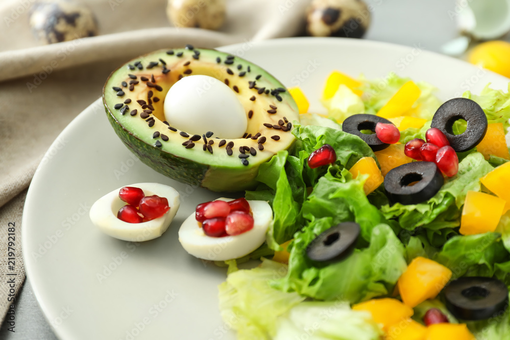 Plate with tasty avocado salad on table, closeup Plate with tasty avocado salad on table, closeup