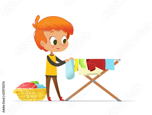 Adorable little redhead boy hanging washed clothes on drying rack isolated on white background. Home activity for kids in Montessori environment. Colorful vector illustration in flat cartoon style.