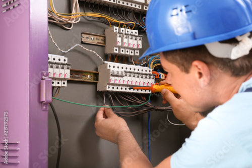 Electrician repairing distr...