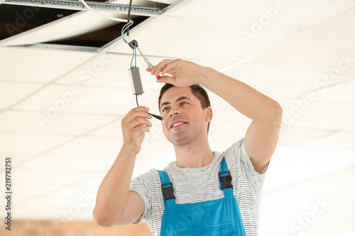 Electrician checking voltag...
