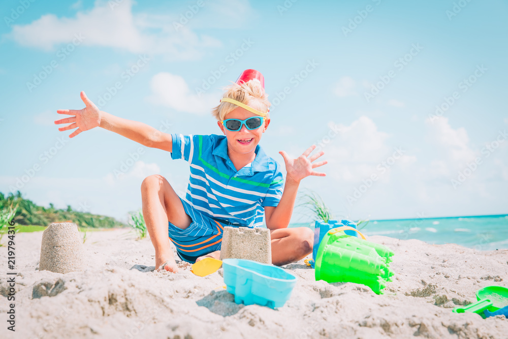 happy boy play with toys on beach happy boy play with toys on beach