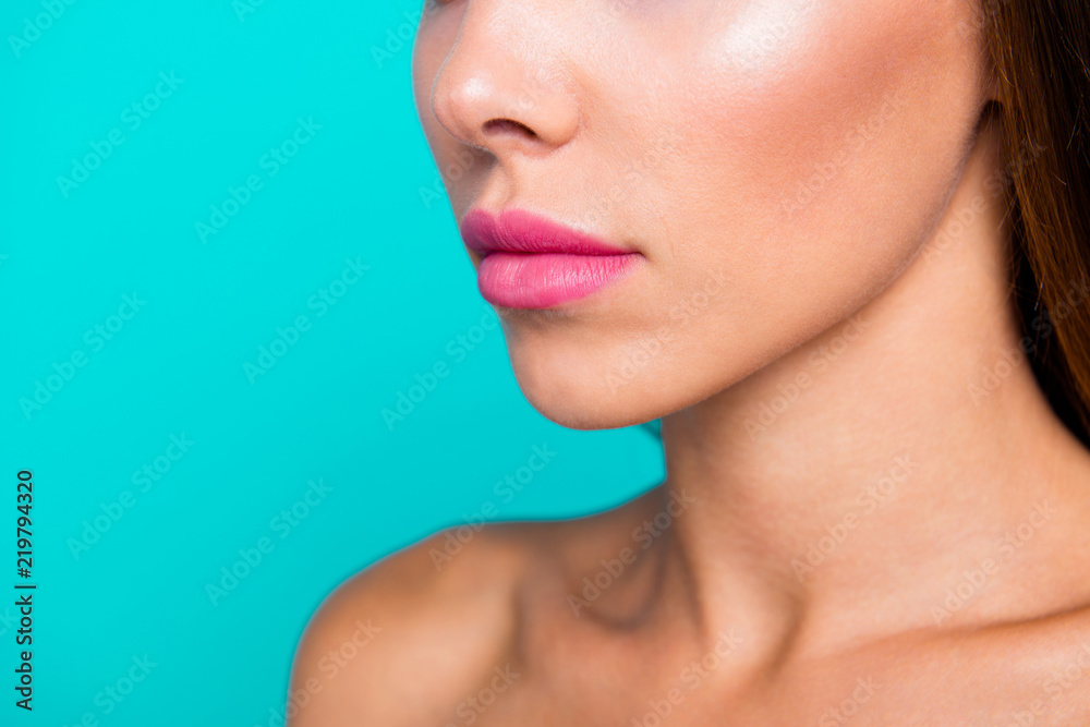Half faced turned close up studio photo portrait of charming pretty attractive lady with perfect nice soft moisturized skin isolated on blue bright background Half faced turned close up studio photo portrait of charming pretty attractive lady with perfect nice soft moisturized skin isolated on blue bright background