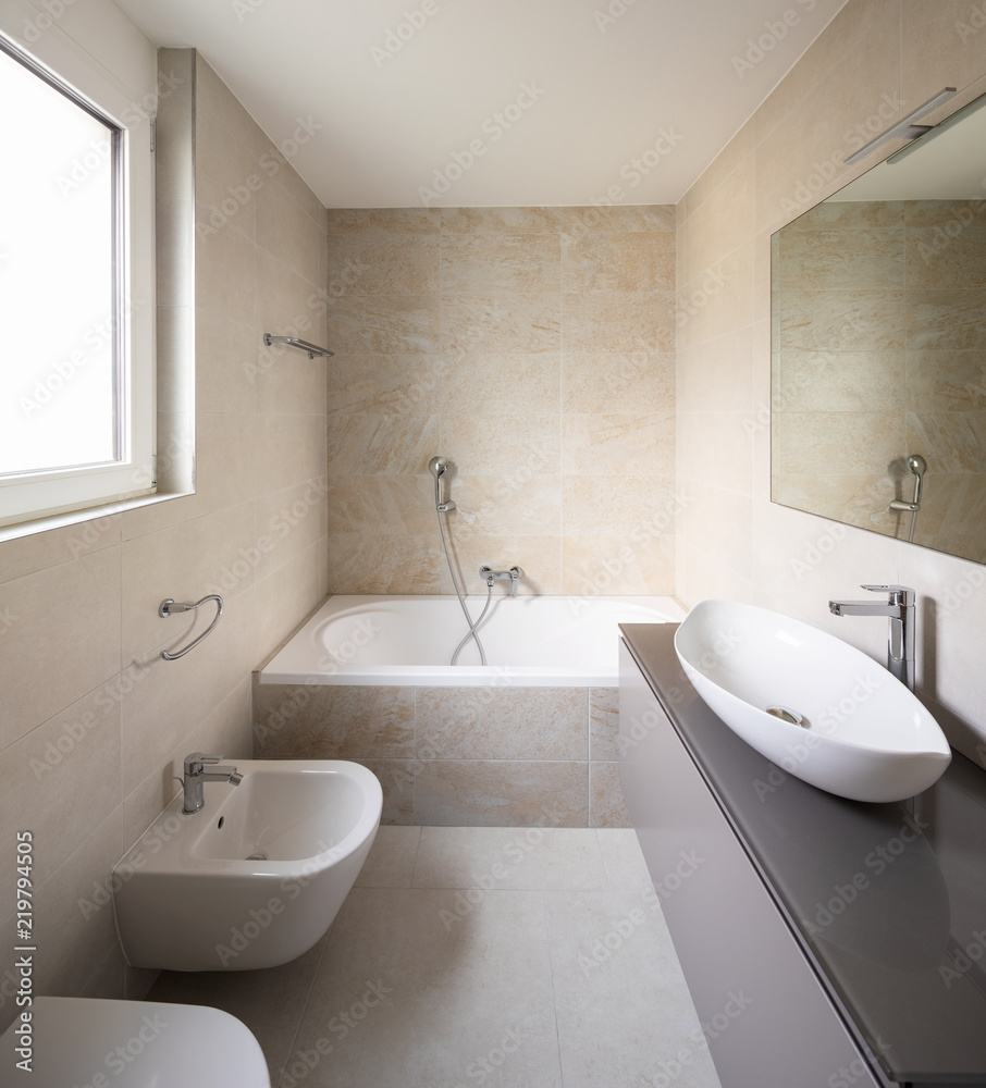 Modern bathroom with large marble tiles Modern bathroom with large marble tiles