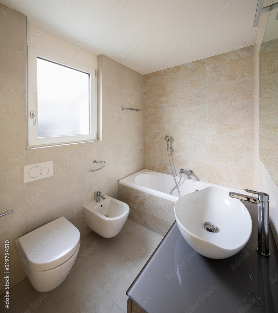 Fototapeta premium Modern bathroom with large marble tiles