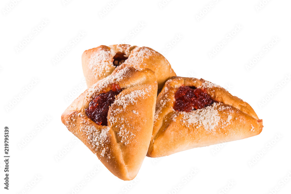 baked triangular cakes with sweet stuffing inside, strawberries, currants, close-up, white background