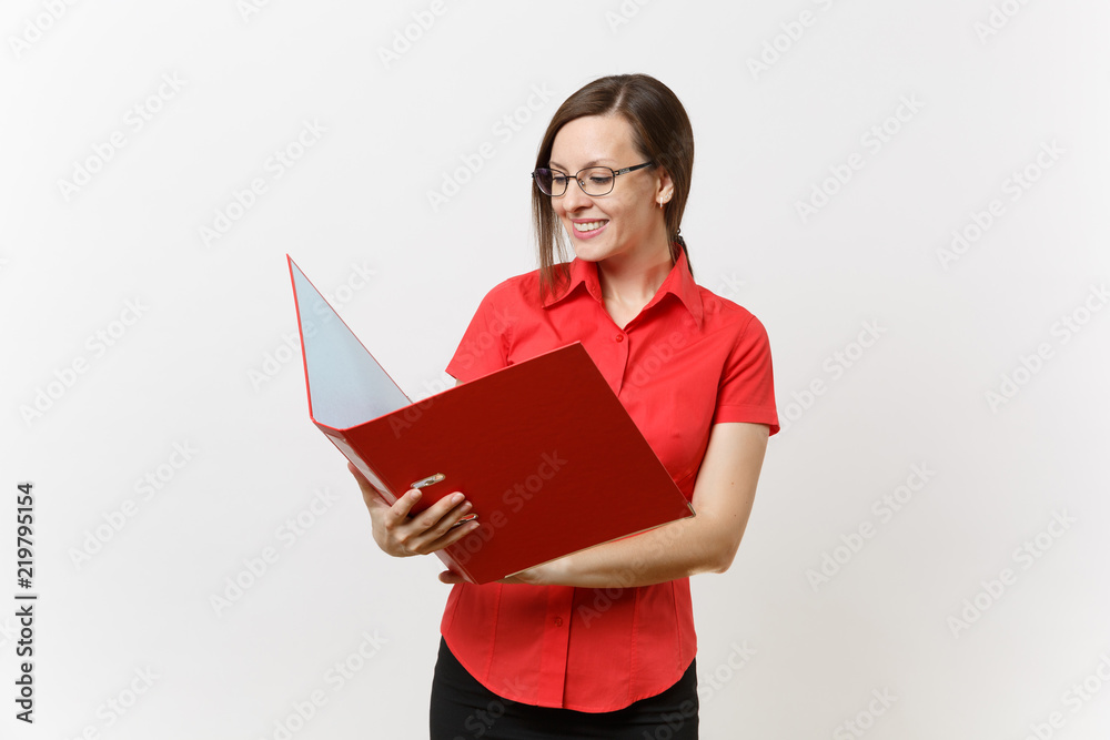 Portrait of young successful business teacher woman in red shirt, glasses holding folder with paper work documents isolated on white background. Education teaching in high school university concept. Portrait of young successful business teacher woman in red shirt, glasses holding folder with paper work documents isolated on white background. Education teaching in high school university concept.