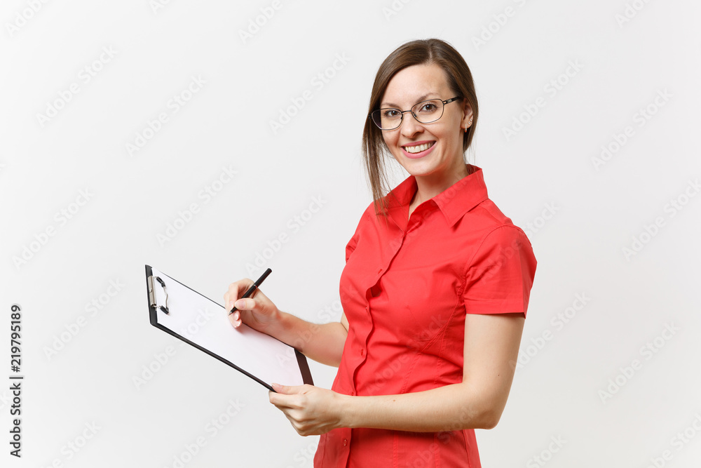Portrait of young business teacher woman in red shirt, glasses holding pen clipboard with blank empty paper documents isolated on white background. Education teaching in high school university concept Portrait of young business teacher woman in red shirt, glasses holding pen clipboard with blank empty paper documents isolated on white background. Education teaching in high school university concept