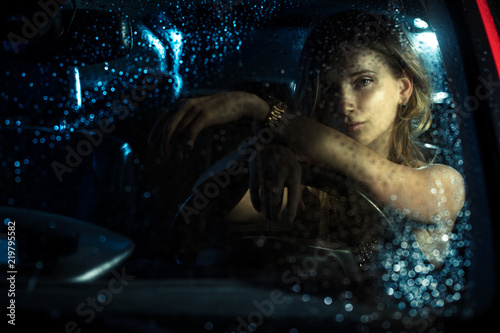 woman in car night light © Anna Stakhiv