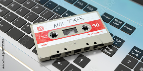 Vintage audio cassette, text mix tape on the label, on a laptop. 3d illustration photo