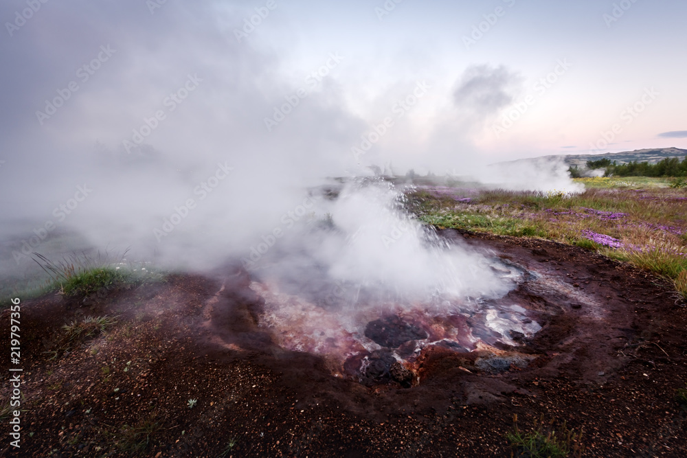 Smoking fumarole on Haukadalur valley near famous Geysir geyser in southwestern Iceland, Europe. Landscape photography