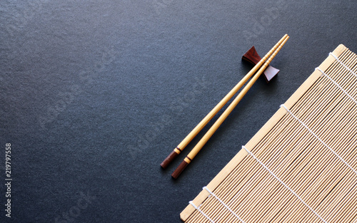 wood chopsticks on black table background