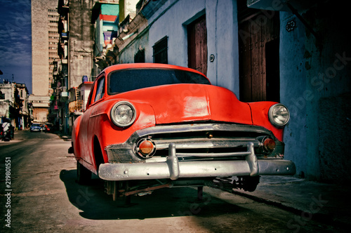 old american car of the 50s parked for repairs on a street in Havana © javier