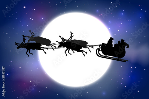Father Christmas riding his sleigh with reindeer in front of a full moon on blue starry sky background.