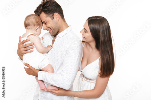 Portrait of a happy young family with their little baby girl