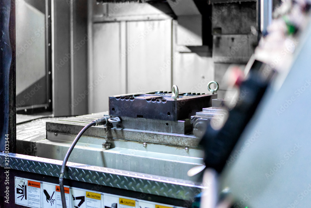 Fototapeta High precision CNC machining center working, operator machining automotive die mold process in factory