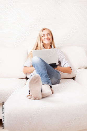 Woman on the sofa with laptop